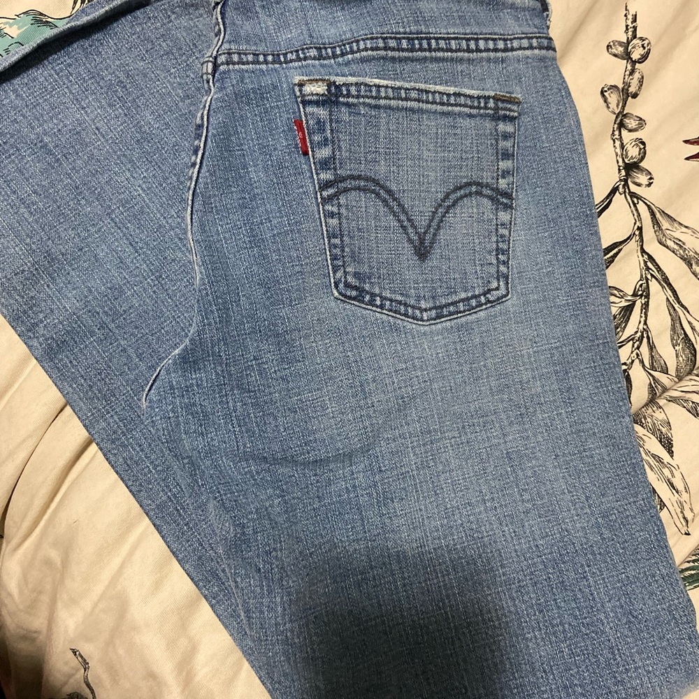 Two high brand denim jeans. Lacoste and Levi’s  pre owned.